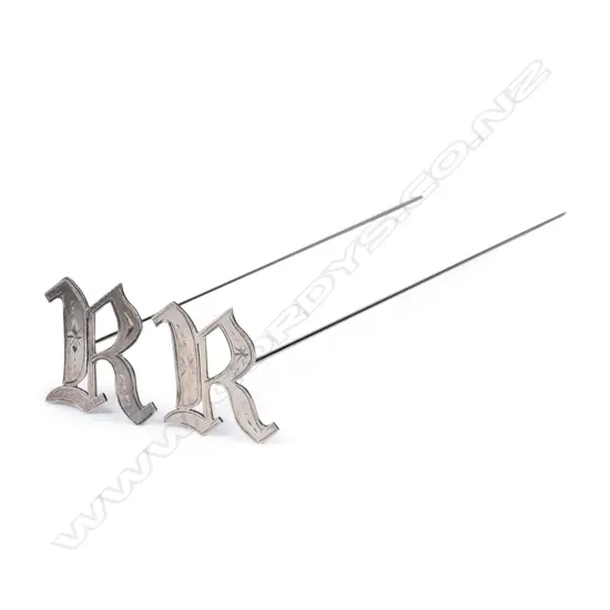 A pair of B. Petersen & Co. (Christchurch) silver Rangi Ruru Girls' School hair pins